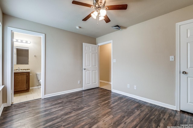 203 Carranza St, San Antonio, TX 78225 - unfurnished bedroom featuring dark wood-type flooring, baseboards, ensuite bath, and a ceiling fan