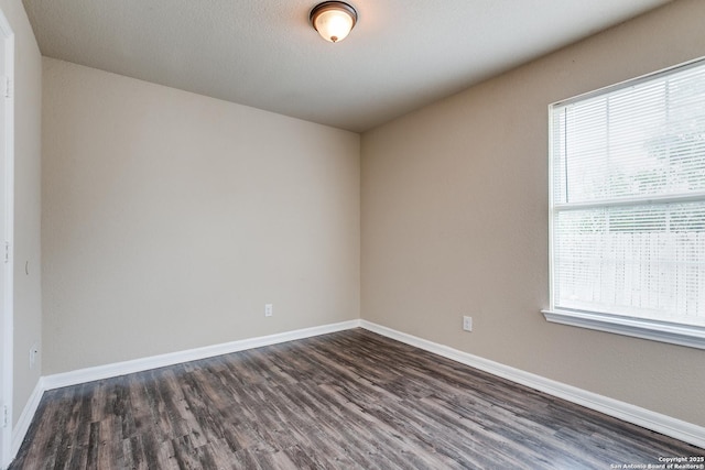 203 Carranza St, San Antonio, TX 78225 - unfurnished room with dark wood finished floors, healthy amount of natural light, and baseboards