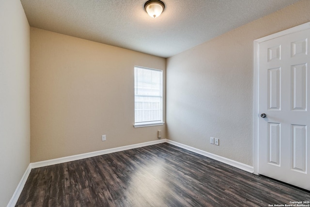 203 Carranza St, San Antonio, TX 78225 - spare room featuring dark wood-style flooring and baseboards