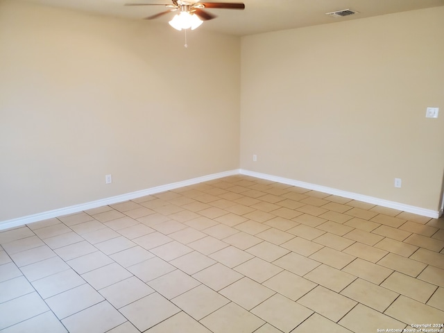 unfurnished room featuring ceiling fan and light tile patterned floors