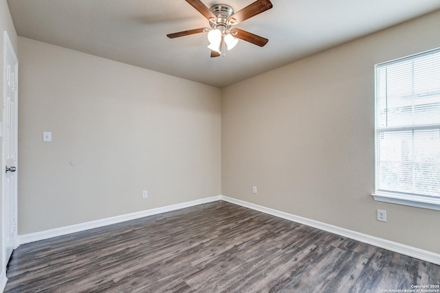 203 Carranza St, San Antonio, TX 78225 - unfurnished room featuring dark wood-style flooring, a ceiling fan, and baseboards