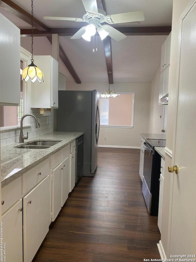 kitchen featuring decorative light fixtures, stainless steel appliances, backsplash, white cabinetry, and sink