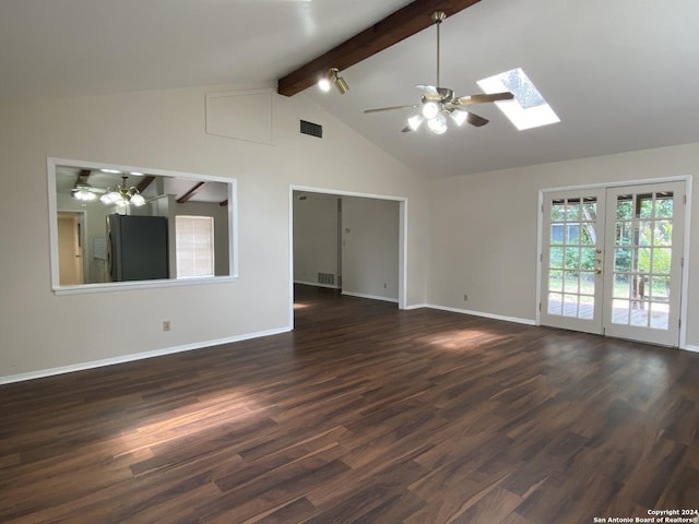 empty room with a skylight, ceiling fan, dark hardwood / wood-style flooring, french doors, and beam ceiling