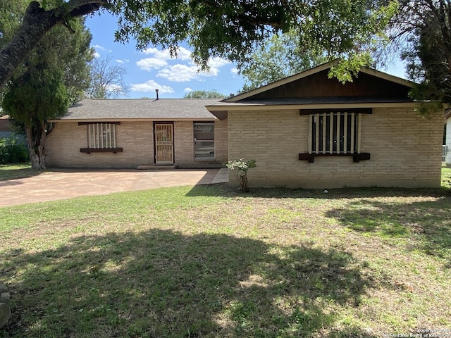 single story home featuring a patio area and a front lawn