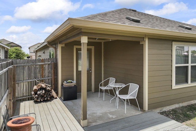 wooden terrace with a patio