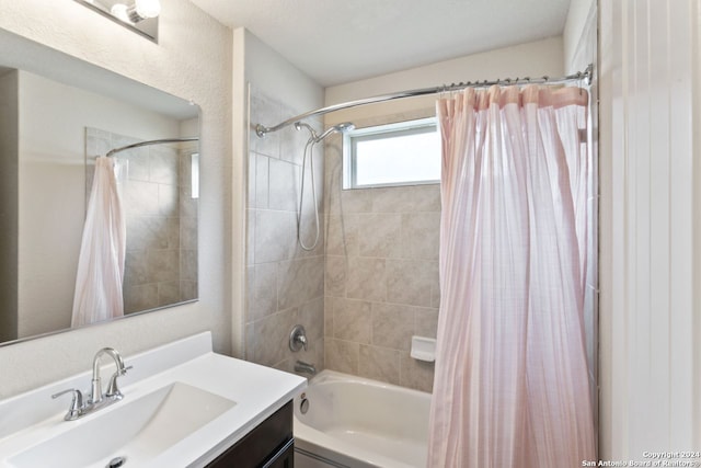 bathroom featuring vanity and shower / bath combo