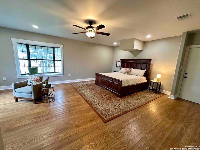 bedroom featuring ceiling fan and hardwood / wood-style flooring