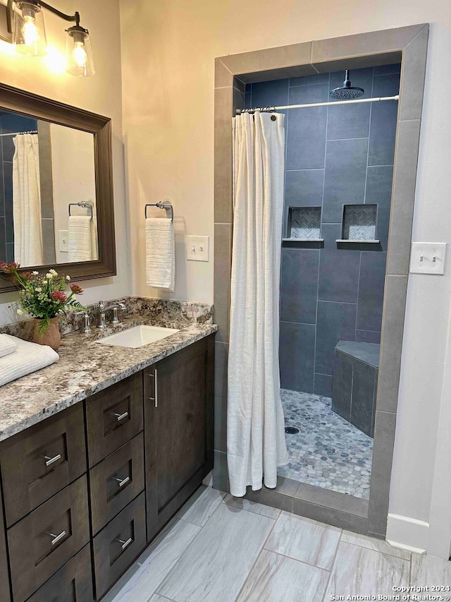 bathroom with vanity, tile patterned floors, and a shower with shower curtain