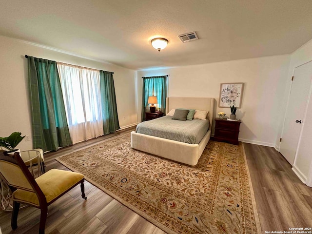 bedroom featuring hardwood / wood-style floors