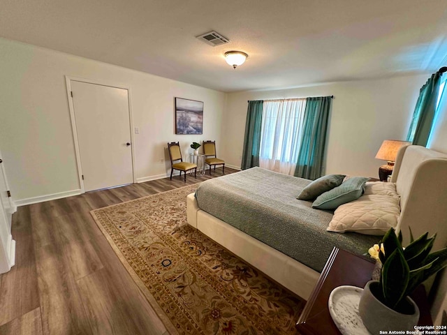 bedroom featuring dark hardwood / wood-style floors