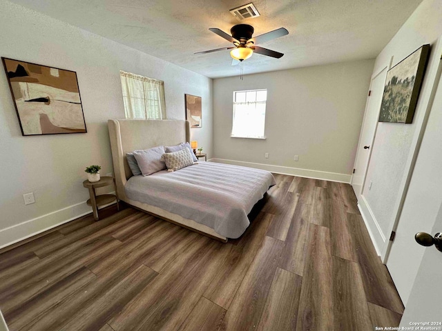 bedroom with ceiling fan and hardwood / wood-style floors