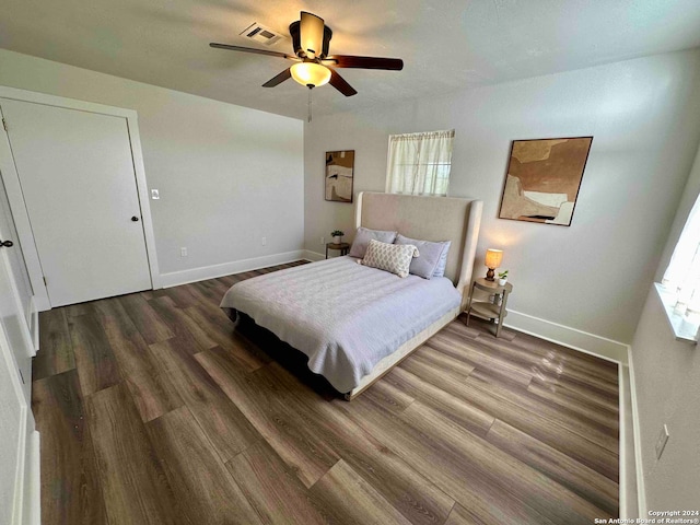 bedroom with ceiling fan and hardwood / wood-style floors