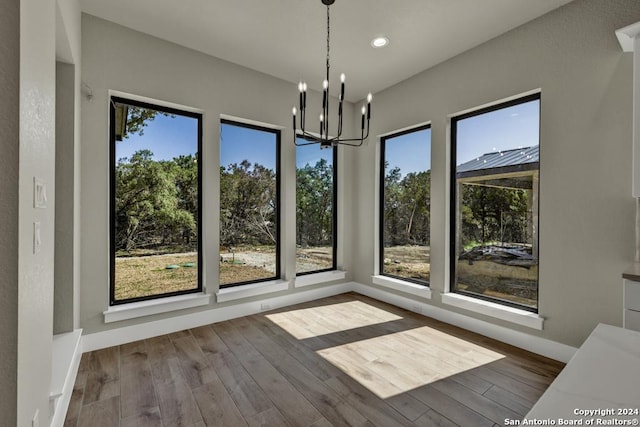 interior space with a healthy amount of sunlight and a notable chandelier