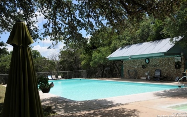 view of pool featuring a patio area