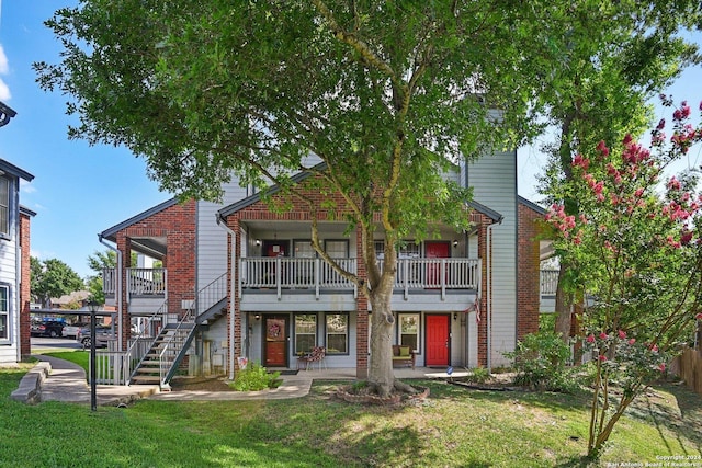 14343 Judson Rd Unit 803, San Antonio, TX 78233 - view of front facade featuring a front lawn and stairway