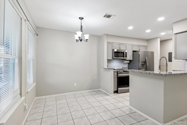 14343 Judson Rd Unit 803, San Antonio, TX 78233 - kitchen with appliances with stainless steel finishes, gray cabinets, light stone countertops, a chandelier, and a sink