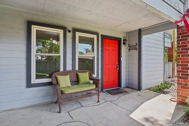 doorway to property featuring covered porch