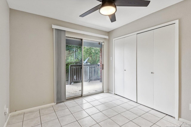 14343 Judson Rd Unit 803, San Antonio, TX 78233 - unfurnished bedroom with access to outside, ceiling fan, light tile patterned floors, a closet, and baseboards