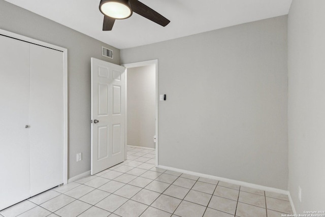 14343 Judson Rd Unit 803, San Antonio, TX 78233 - unfurnished bedroom with light tile patterned floors, a closet, baseboards, and a ceiling fan
