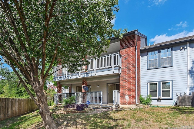 14343 Judson Rd Unit 803, San Antonio, TX 78233 - rear view of house with central AC unit, a balcony, and a porch