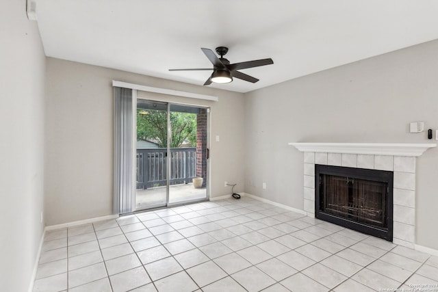 unfurnished living room with light tile patterned floors, a tile fireplace, and ceiling fan