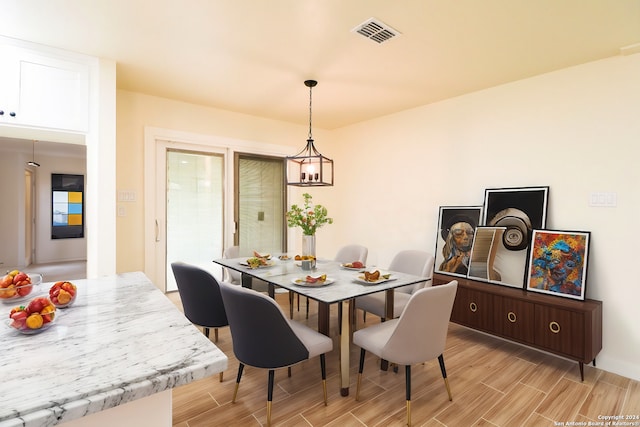 dining space featuring an inviting chandelier