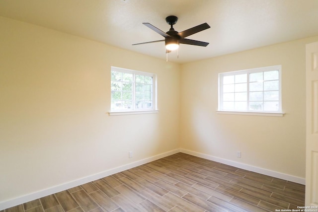 spare room featuring ceiling fan and wood-type flooring