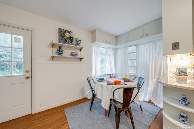 dining area featuring hardwood / wood-style floors