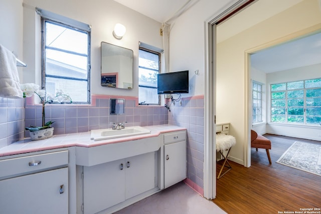 bathroom with vanity and hardwood / wood-style floors