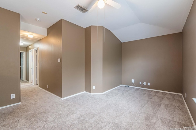 interior space featuring vaulted ceiling, ceiling fan, and light colored carpet