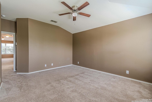 unfurnished room featuring light carpet, ceiling fan, and lofted ceiling