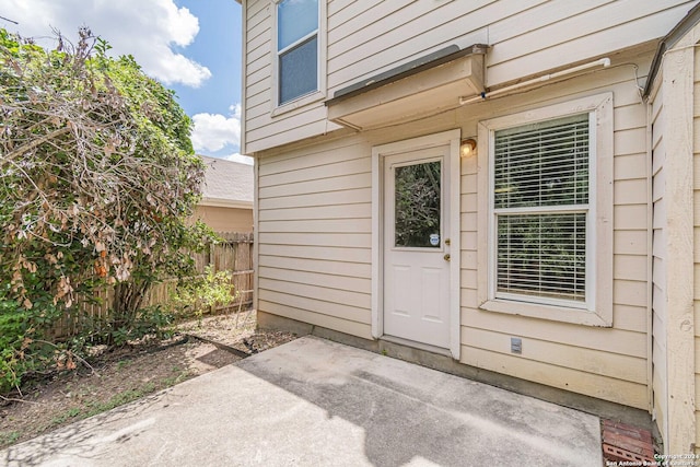 property entrance with a patio