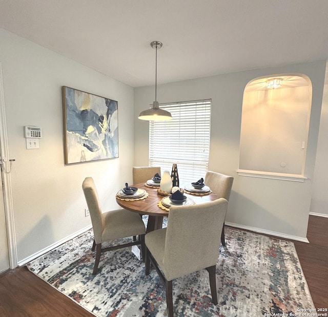 dining space featuring dark hardwood / wood-style floors