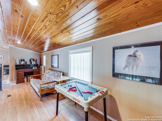 rec room featuring ornamental molding, wood ceiling, and wood finished floors