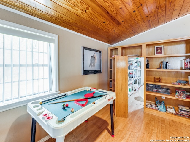 recreation room with light hardwood / wood-style floors, lofted ceiling, crown molding, and wood ceiling