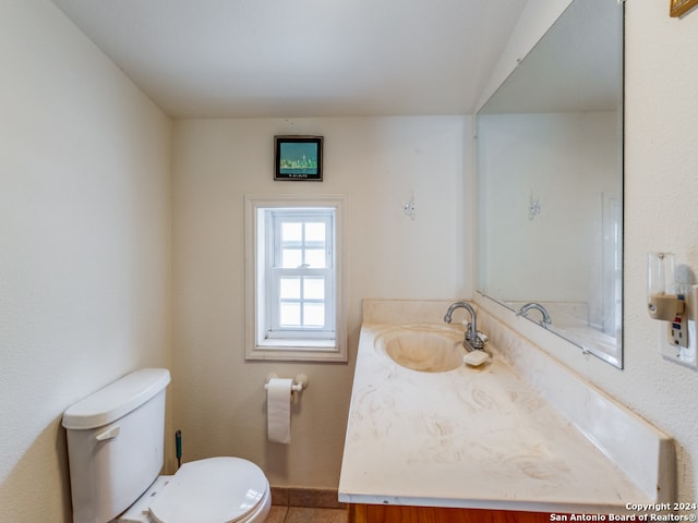 bathroom featuring vanity and toilet