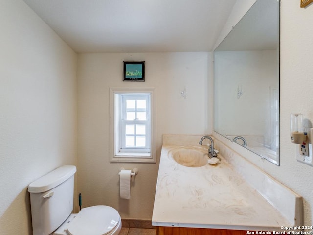 bathroom with vanity and toilet