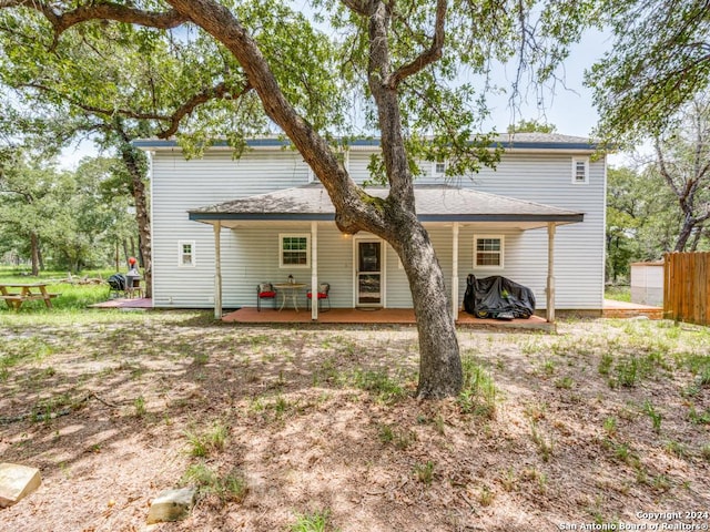 back of property with fence