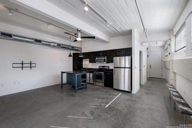 kitchen with range, concrete flooring, ceiling fan, beamed ceiling, and sink