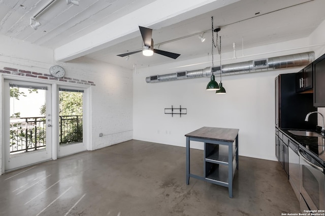 garage featuring ceiling fan and sink