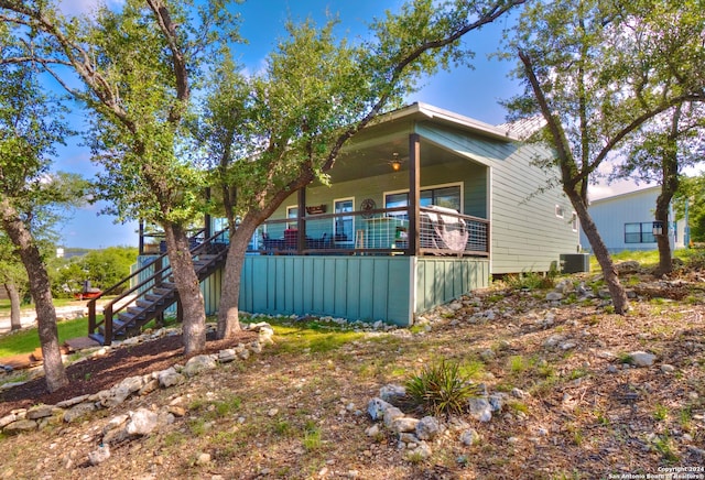 view of home's exterior featuring ceiling fan and central AC unit