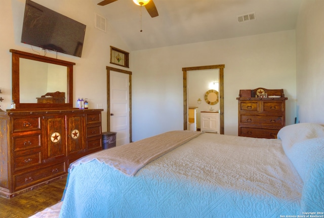 bedroom featuring connected bathroom, ceiling fan, wood-type flooring, and vaulted ceiling