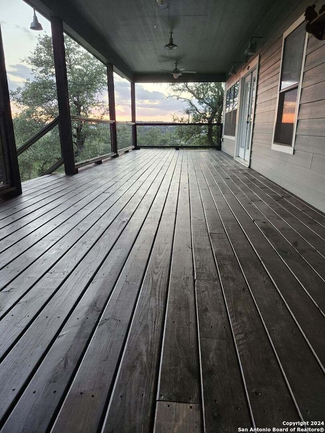 deck at dusk with ceiling fan