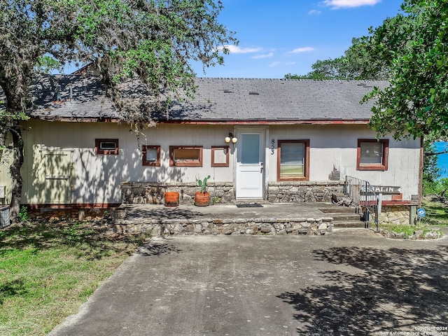853 Glenn Dr, Canyon Lake, TX 78133 - rear view of house with a sunroom