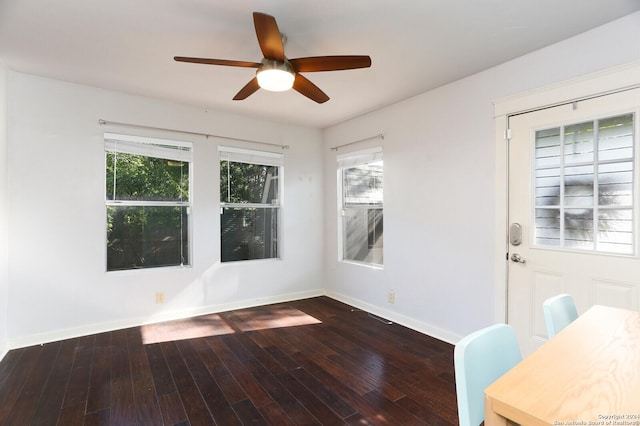 empty room featuring ceiling fan and dark hardwood / wood-style floors