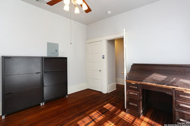 unfurnished office with ceiling fan and dark hardwood / wood-style floors