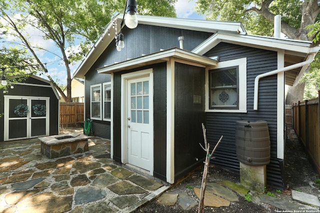 exterior space with a patio area and a shed