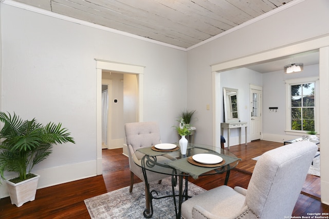 dining space featuring ornamental molding, wooden ceiling, and hardwood / wood-style floors