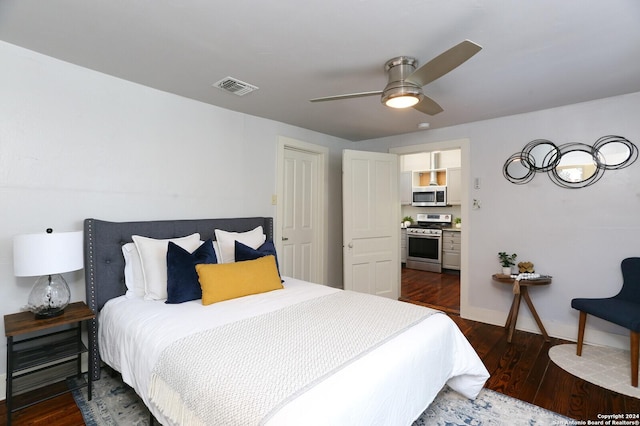 bedroom with ceiling fan and dark hardwood / wood-style flooring