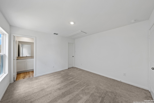 carpeted spare room with a healthy amount of sunlight